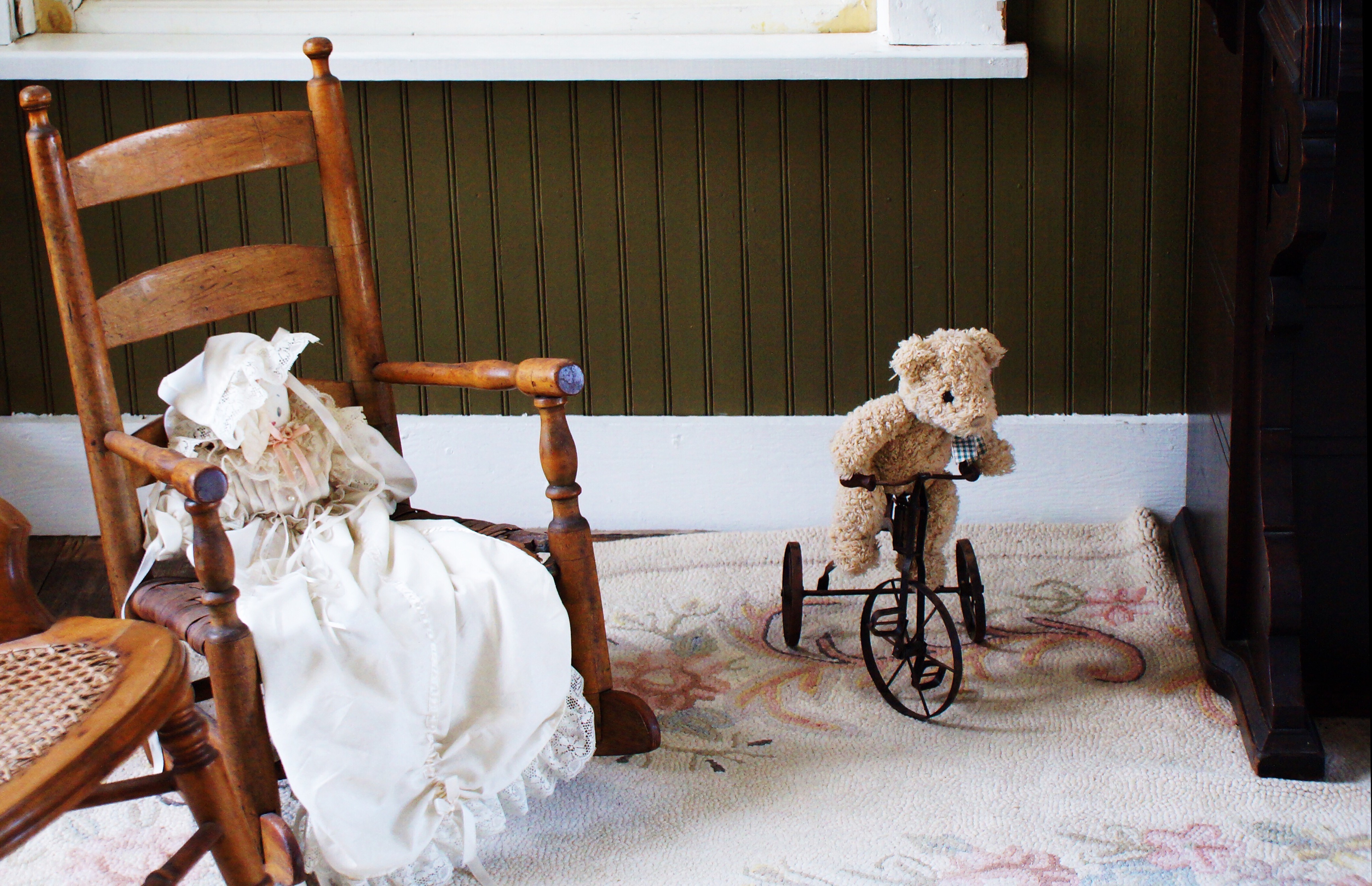 Bear on bike with Lambchop in chair.
