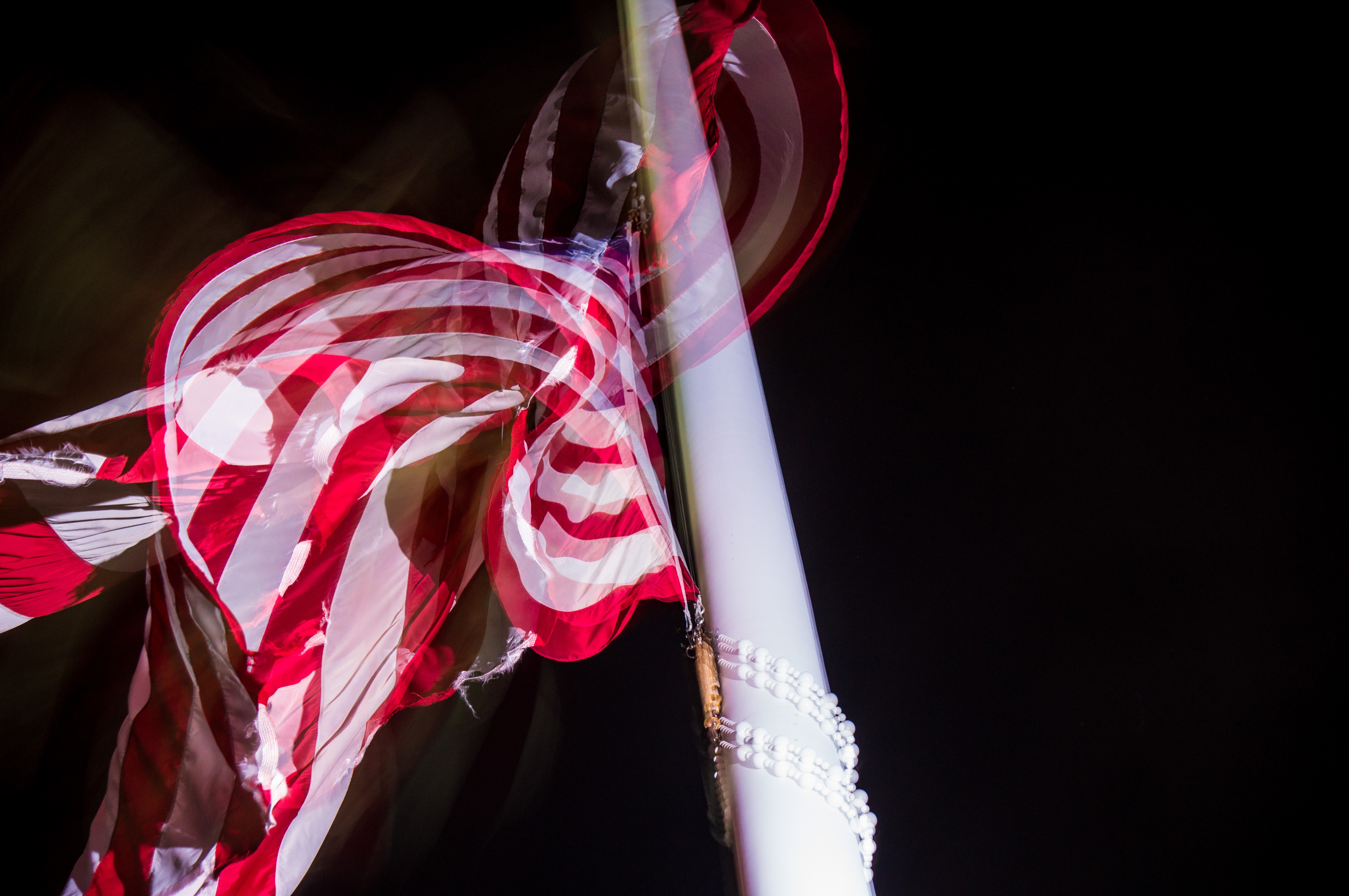 Flag swirling in a blackened sky