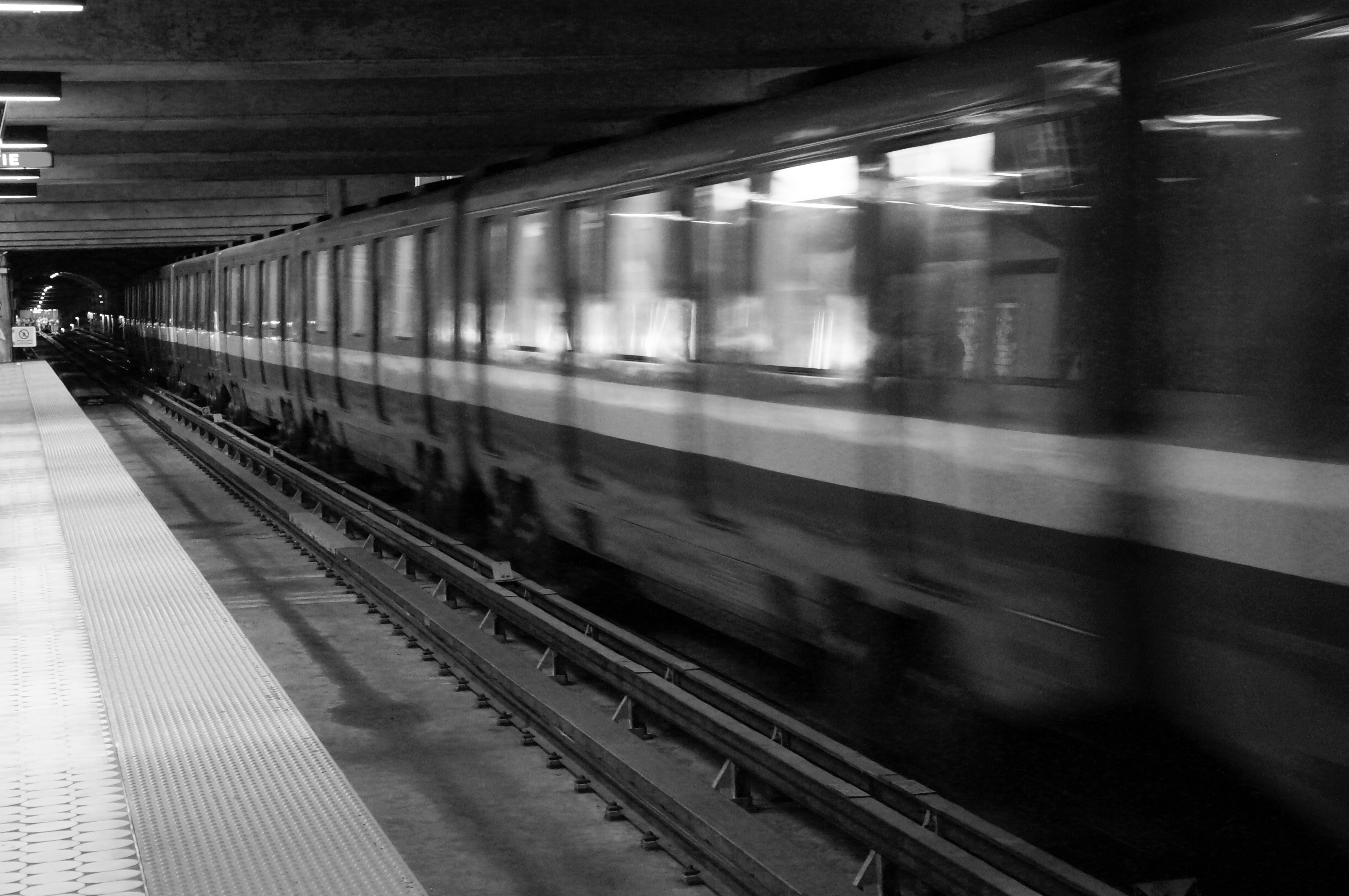 Train in motion in black and white
